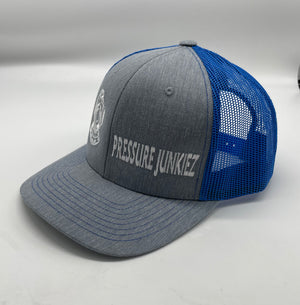 Blue/ gray snap back trucker hat. White dive hat, white writing.