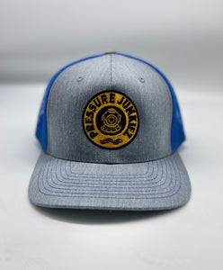 Blue/ gray snap back trucker hat. Pressure JUNKIEZ logo