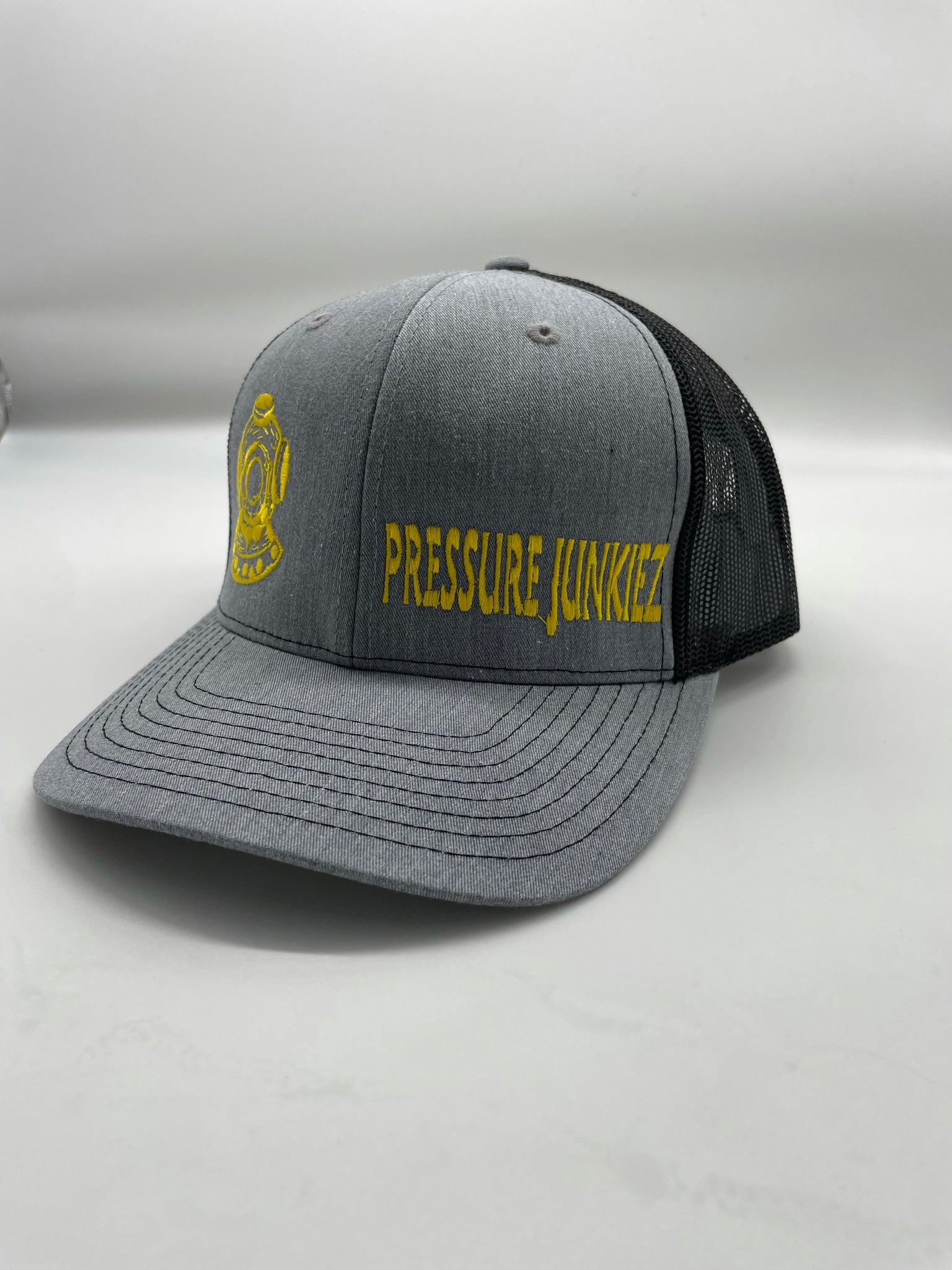 Gray/ black snap back trucker hat. Yellow dive hat, yellow writing